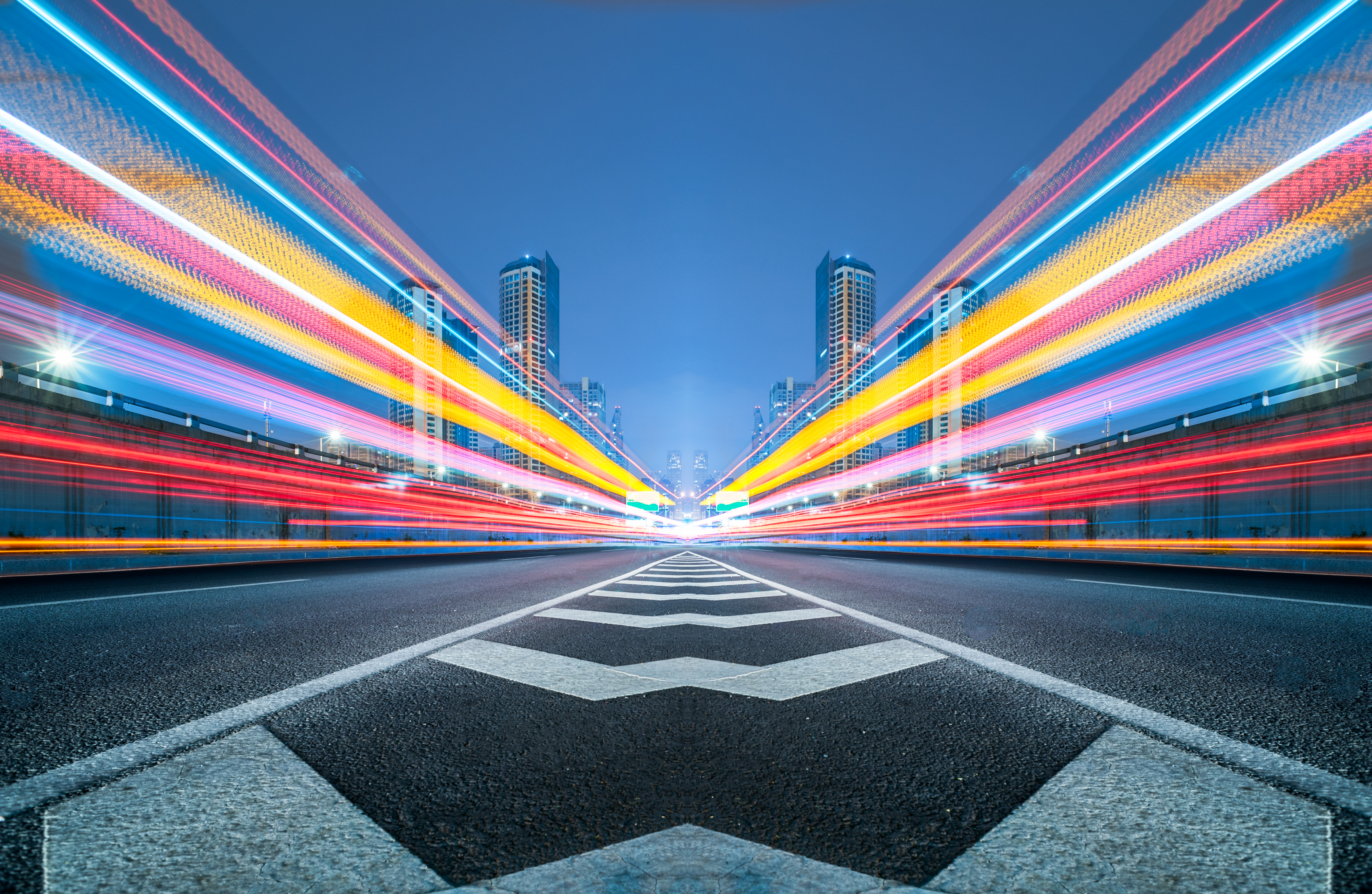 blurred traffic light trails on road