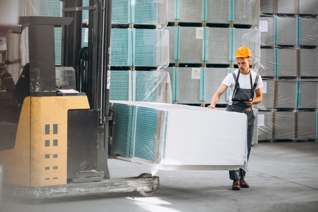 young man working warehouse with boxes