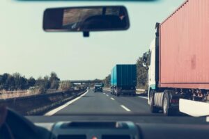 trucks driving along road