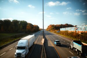 truck and cars driving on highway