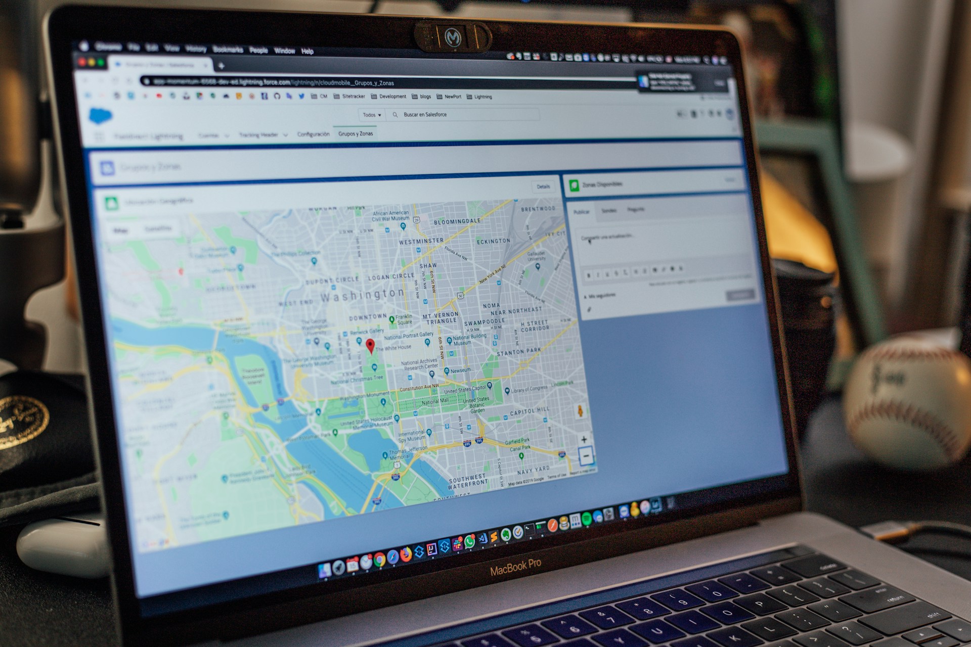 Laptop screen displaying a GPS tracking map with a fleet location marked