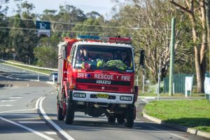 Firefighters operating emergency vehicles