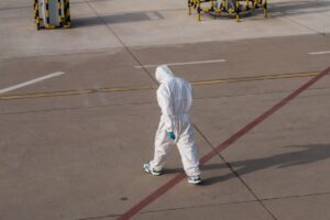 Man in hazmat suit walking