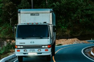 Box truck driving along road