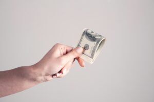 Hand holding out money
