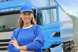 your truck driver standing in front of a truck