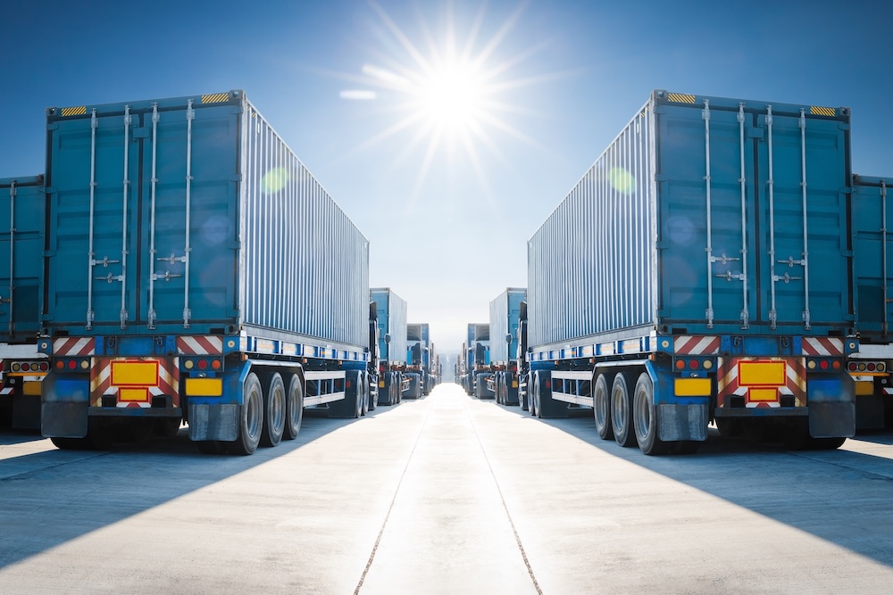Many Semi Trailer Trucks on The Parking Lot at The Port. Big Rig. Economy Business Transport on Road. Shipping Container Import- Export. Warehouse Port. Trucking. Freight Logistics Transportation.