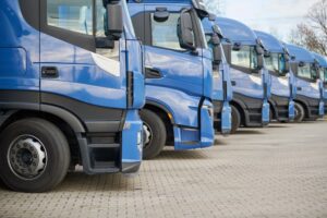 Fleet of commercial trucks in a row