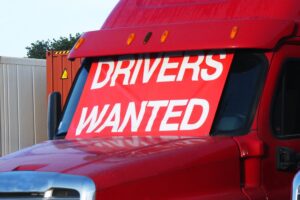 truck with "drivers wanted" sign