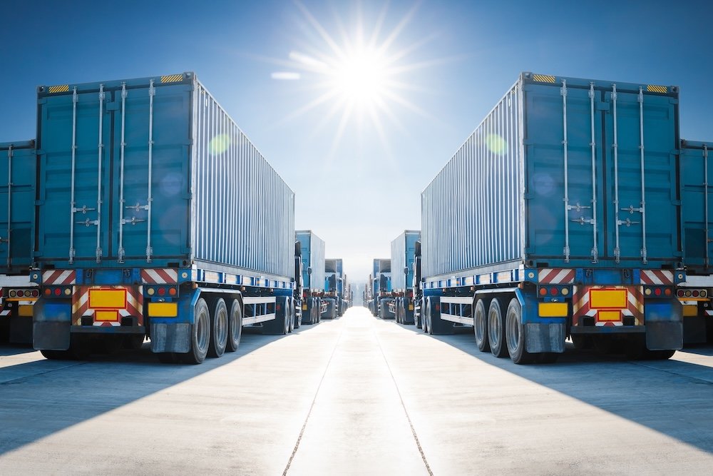 Many Semi Trailer Trucks on The Parking Lot at The Port. Big Rig. Economy Business Transport on Road. Shipping Container Import- Export. Warehouse Port. Trucking. Freight Logistics Transportation.
