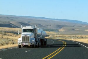 commercial freight truck travel on a rural highway