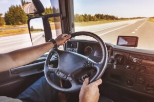 man driving truck on the open road