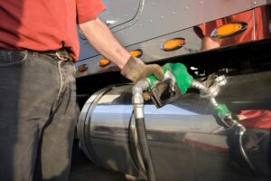 man pumping diesel into a truck