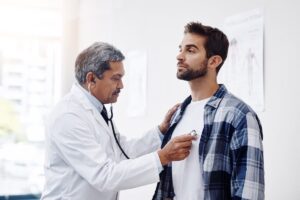 patient and doctor with stethoscope for checkup
