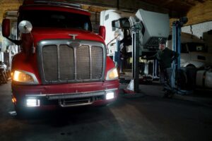 Big red truck parked in a garage