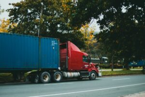 Red and blue truck on a road