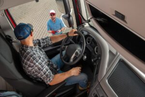 Freight Dispatcher Giving Last Instruction To Semi Truck Driver.
