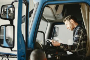 truck driver looking at paper work