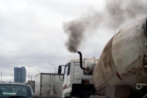smoky truck in a traffic jam