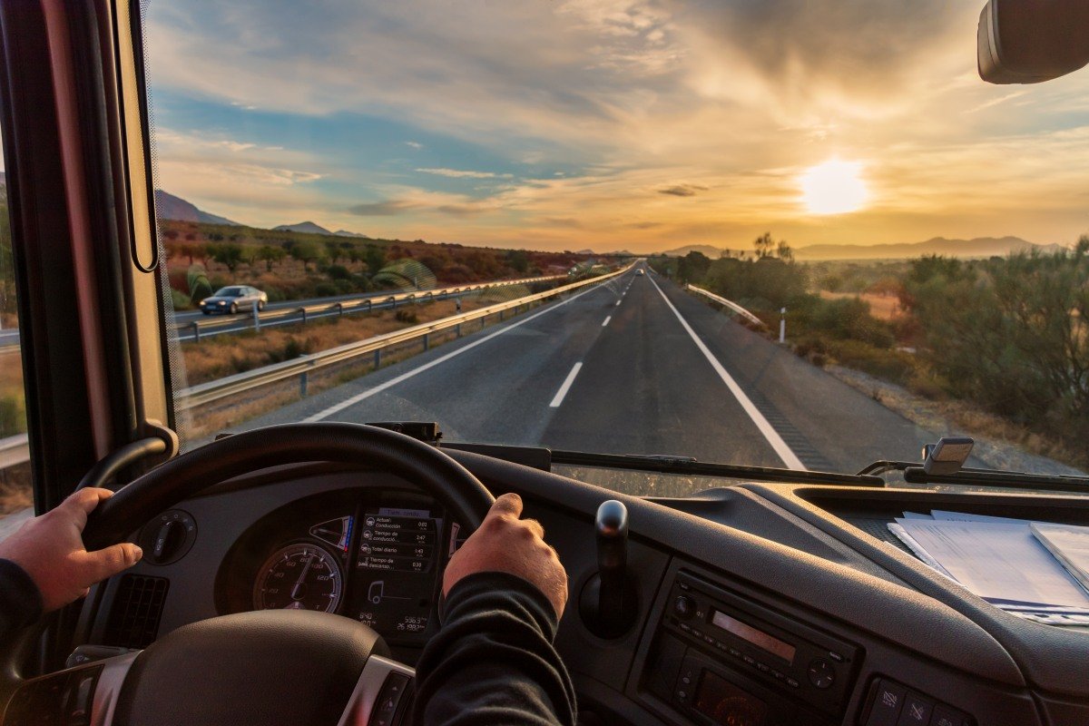 View from the driver's seat of a truck of the highway and a land