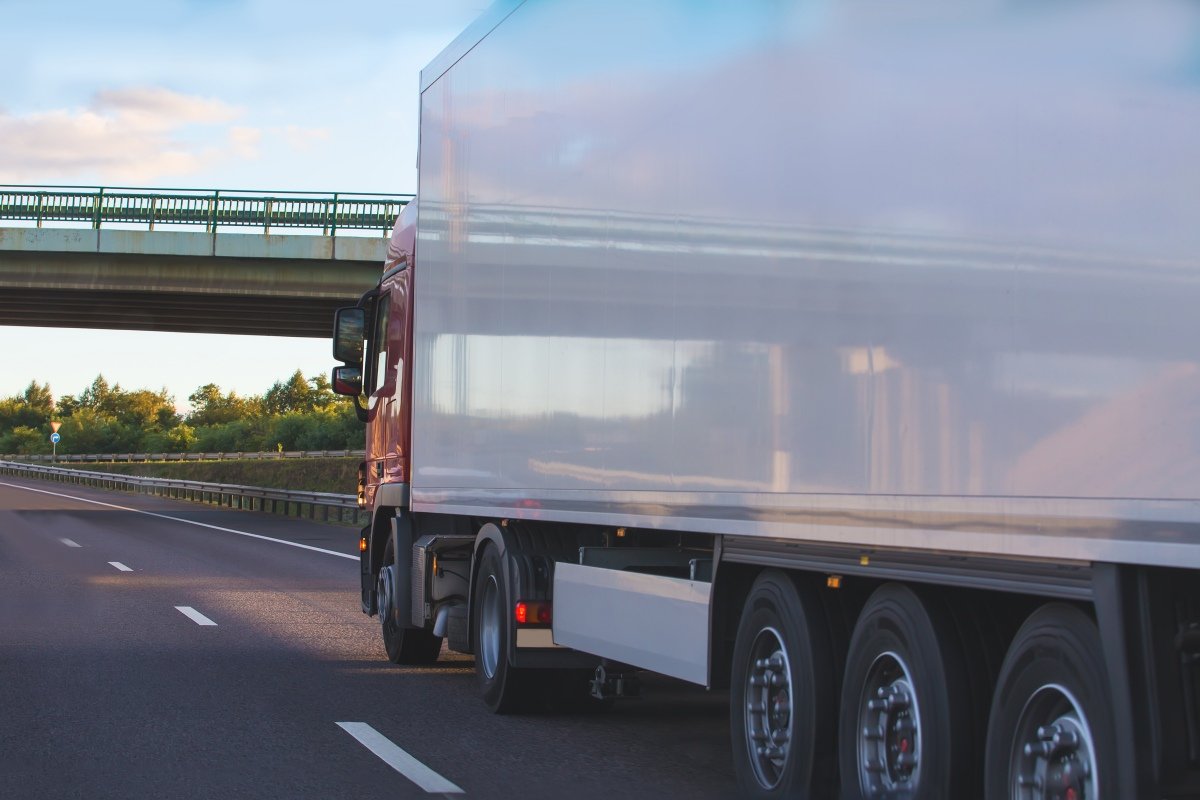 Trucks move under viaduck.