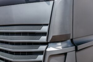 View on gray truck hood radiator grill.