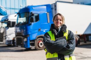Woman truck driver working in logistics and transportation