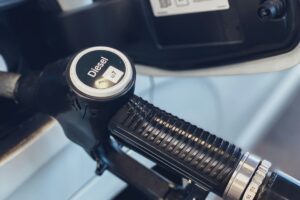 Close-up of a diesel fuel pump nozzle at a fueling station