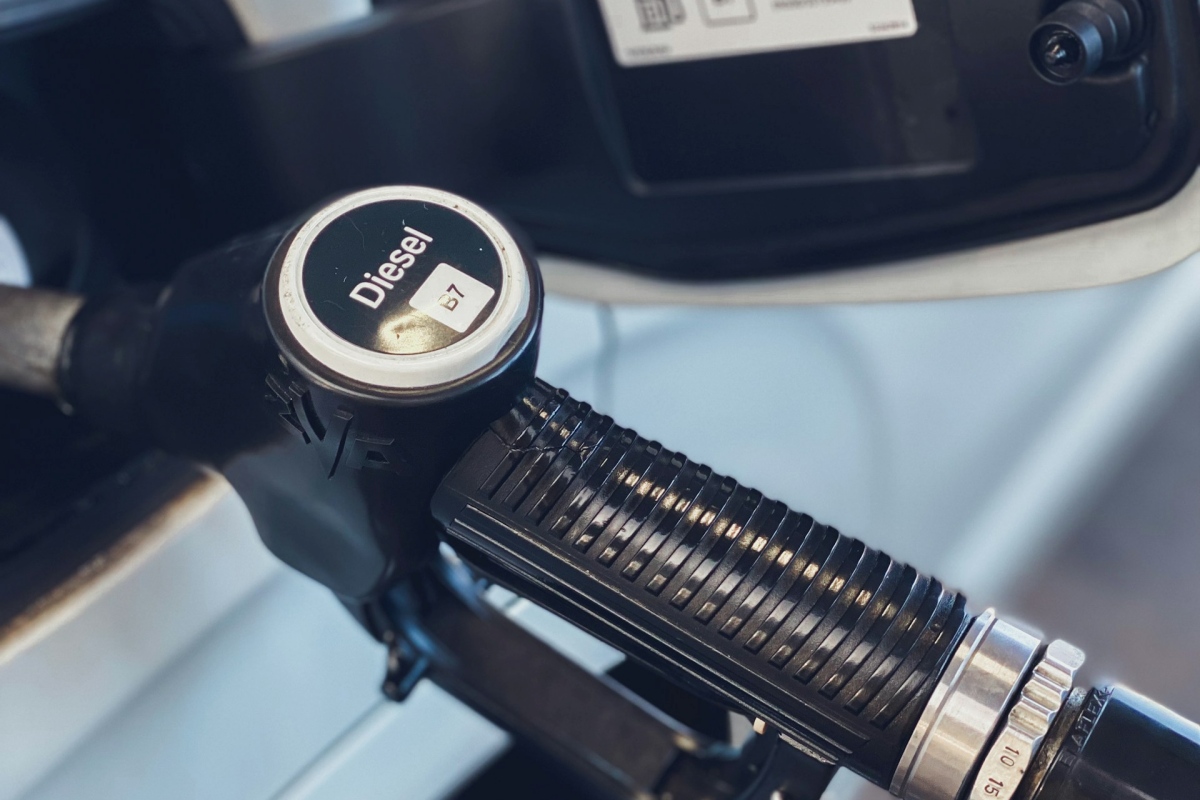 Close-up of a diesel fuel pump nozzle at a fueling station