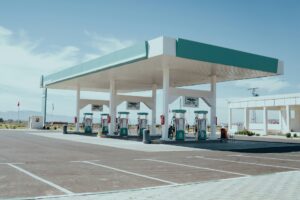 Fuel station with multiple diesel pumps under a canopy roof