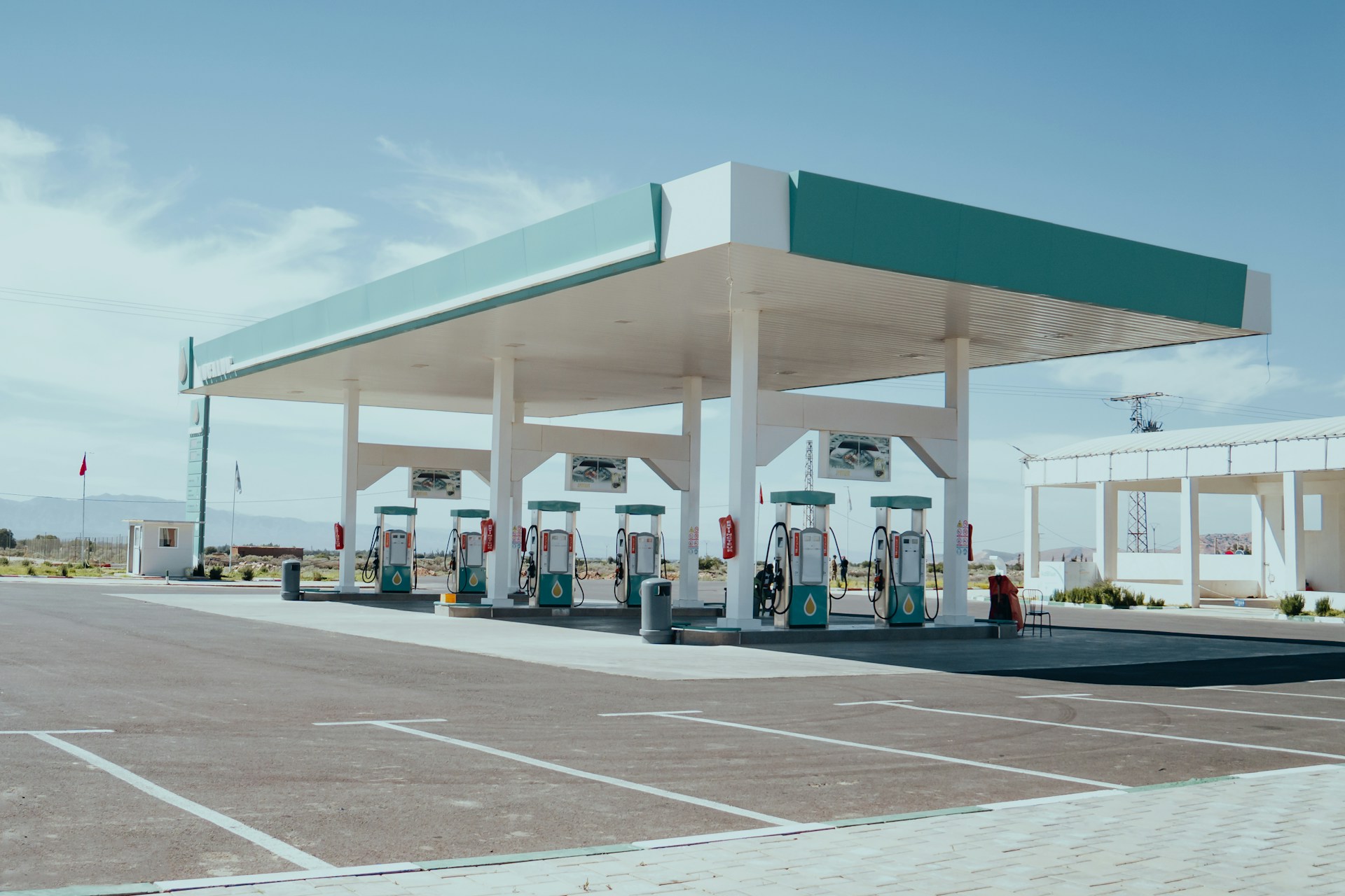 Fuel station with multiple diesel pumps under a canopy roof