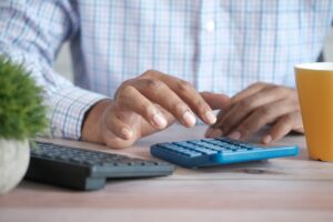 Business owner calculating monthly payments for commercial truck financing