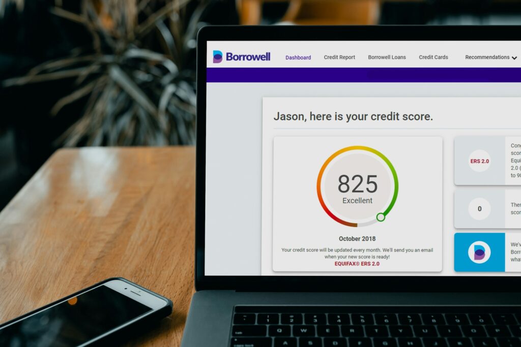 Laptop screen showing an 825 credit score rated excellent on a credit monitoring dashboard